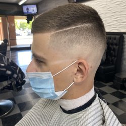 Bald fade with a hard part. Semi natural lining in the front. -CC