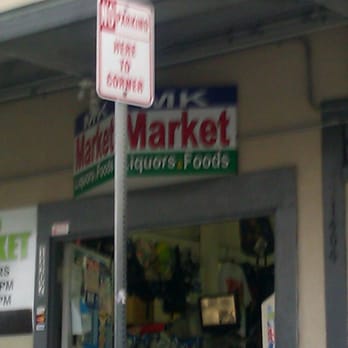 MK Market - a street sign in front of a store - Grocery Near Me - Honolulu, Hawaii MK Market - a street sign in front of a store - Grocery Near Me - Honolulu, Hawaii