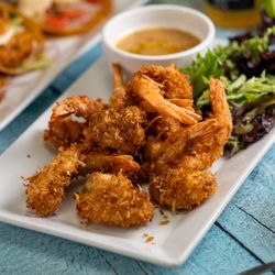 FreshCo Fish Market & Grill - COCONUT SHRIMP
Local shrimp coaded with a blend of sweet coconut flakes and bread crumbs. Served with peanut coconut sauce.