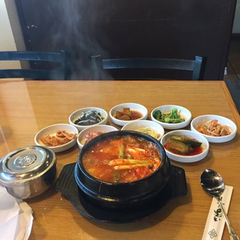 Jinmi Korean Restaurant - Still boiling, see the steam! Plenty of sides - Korean Near Me - Anchorage, Alaska