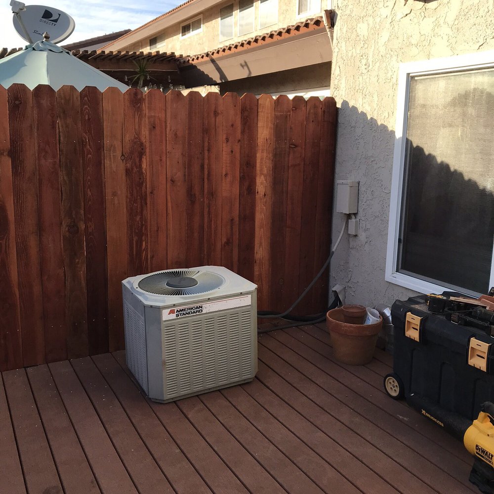 an air conditioner on a deck an air conditioner on a deck