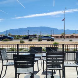 Dunkin' - View of the outside patio and Sandia Mountains out the front windows.