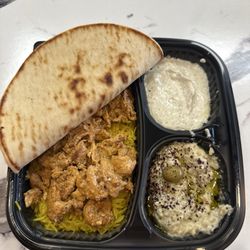 #6 Grilled Chicken Shawarma served over rice. Paired with garlicky white sauce & baba ganoush with a side of pita and a drink.
