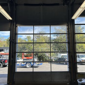 Infinite Garage Doors - Installed two new commercial spring on this full glass commercial door - Garage Door Services Near Me Infinite Garage Doors - Installed two new commercial spring on this full glass commercial door - Garage Door Services Near Me