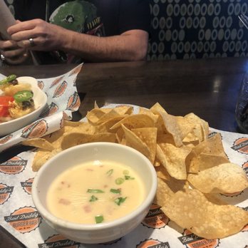 Bad Daddy's Burger Bar - Cheese dip and chips, this was the best thing we had. - Burgers Near Me - Aurora, Colorado Bad Daddy's Burger Bar - Cheese dip and chips, this was the best thing we had. - Burgers Near Me - Aurora, Colorado