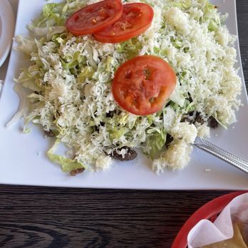 Esther's Taco House - Carnitas Tostada. The amount was wonderful. The cheese was great. The taste was OK, a little on the bland side - Mexican Near Me - Placentia, California