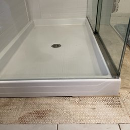 A small wood underneath to level the frameless class
