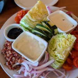 Salty Steer - Large Wedge Salad, a very good meal with real chopped bacon and ripe sweet cherry tomatoes. The ranch is better than the blue.
