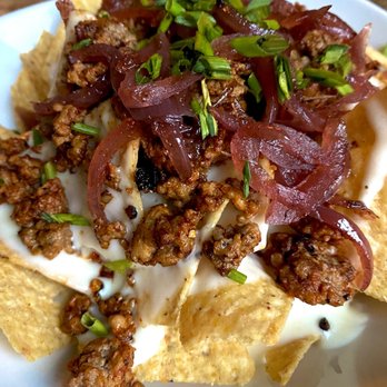 The Belfry - Mega Dope 'Chos (nachos with Manchego queso, chorizo, and sherry onions) - Cocktail Bars Near Me - Kansas City, Missouri The Belfry - Mega Dope 'Chos (nachos with Manchego queso, chorizo, and sherry onions) - Cocktail Bars Near Me - Kansas City, Missouri