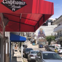 Real Deal California Burrito - Mural with sign on Honduras