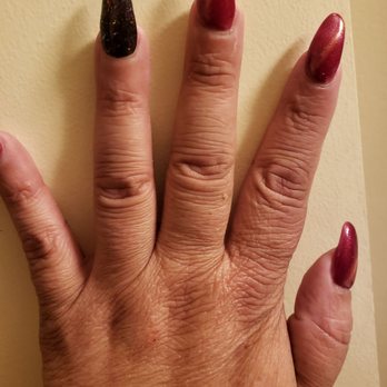 Classy Nails - Cat eye with a black glitter on ring finger. Almond shape. - Nail Salons Near Me - Frederick, Maryland
