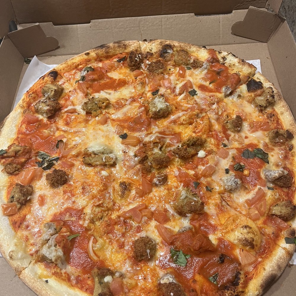 Pizzanada - Vegan Chicken Parmigiana pizza with tomatoes - Empanadas Near Me - Bloomfield, New Jersey