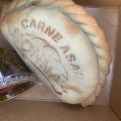 Nonna’s Empanadas - Close up on the empanada. Love the branding!