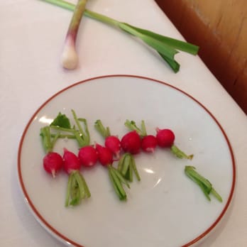 L'Arpège - Amuse-bouche of tiny radishes with sea salt. - French Near Me - Paris, 75 L'Arpège - Amuse-bouche of tiny radishes with sea salt. - French Near Me - Paris, 75