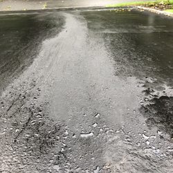 Hertz Rent A Car - The oil cleaner they used cracked the driveway and the stain is showing thru the seal-coat after 3 double applications