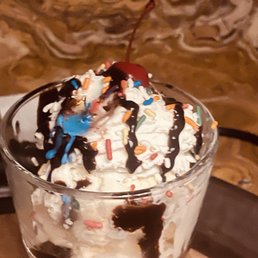 The desert that we couldn't eat because the candles all melted before the spoons arrived to our table. The desert that we couldn't eat because the candles all melted before the spoons arrived to our table.