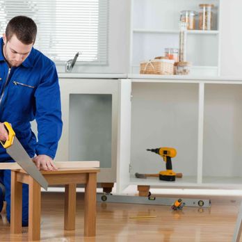 A & D Home Improvements - a man using a saw to cut a piece of wood - General Contractors Near Me A & D Home Improvements - a man using a saw to cut a piece of wood - General Contractors Near Me