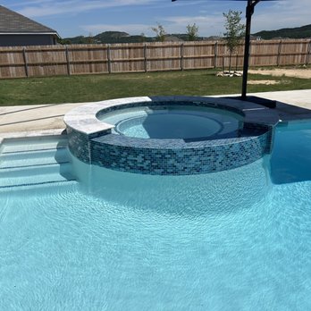 South Texas Pool Tile Cleaning - Our gorgeous, oversized spa with steps tucked off to the side, just like we wanted. I could watch the water spill over the spa all day!! - Pool & Hot Tub Service Near Me - San Antonio, Texas South Texas Pool Tile Cleaning - Our gorgeous, oversized spa with steps tucked off to the side, just like we wanted. I could watch the water spill over the spa all day!! - Pool & Hot Tub Service Near Me - San Antonio, Texas