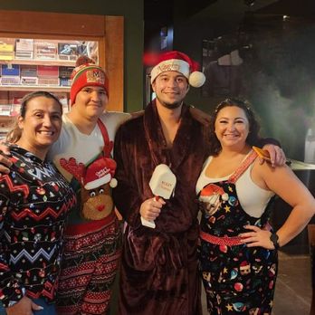 Fairway Cigar Lounge - a group of people dressed up for christmas - Lounges Near Me - Melbourne, Florida