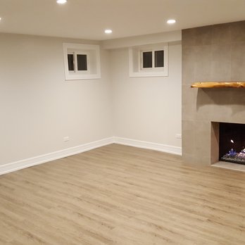 Top GS Construction - a fireplace in the middle of the room - General Contractors Near Me - Mount Prospect, Illinois Top GS Construction - a fireplace in the middle of the room - General Contractors Near Me - Mount Prospect, Illinois