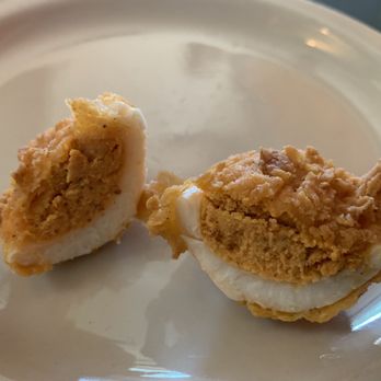 Lucy's Fried Chicken - Cross section of the fried deviled egg - New American Near Me - Austin, Texas Lucy's Fried Chicken - Cross section of the fried deviled egg - New American Near Me - Austin, Texas