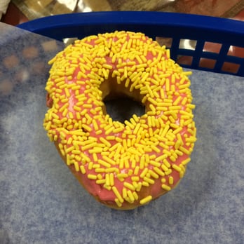 Donut & Cafe - My son's donut.  He told the owner "it was the best donut ever".  He's 5 & it's his first donut, but so sweet. - Donuts Near Me - Carrollton, Texas
