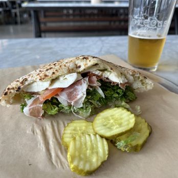 Pieous - Omg this is not just a pizza place. Their sandwiches are wrapped in a fresh baked sourdough pizza pocket!! - Pizza Near Me - Austin, Texas