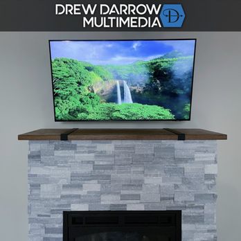 Drew Darrow Multimedia - TV Mounted above a Custom Fireplace - TV Mounting Near Me Drew Darrow Multimedia - TV Mounted above a Custom Fireplace - TV Mounting Near Me