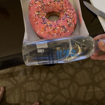 Universal Studios Hollywood - Same donut but holding up water bottle to show how large it is. - Amusement Parks Near Me - Universal City, California Universal Studios Hollywood - Same donut but holding up water bottle to show how large it is. - Amusement Parks Near Me - Universal City, California