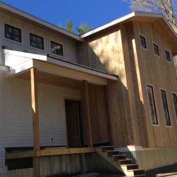 KAJ Construction - After installation of hardie shingle siding, hardie panels, vertical bettens, pvc trim and vertical tong and grove cedar siding. - Windows Installation Near Me - Framingham, Massachusetts