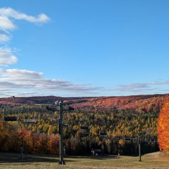 Treetops Resort - Chairlift at Treetops Resort with spectacular Fall view. - Resorts Near Me - Gaylord, Michigan
