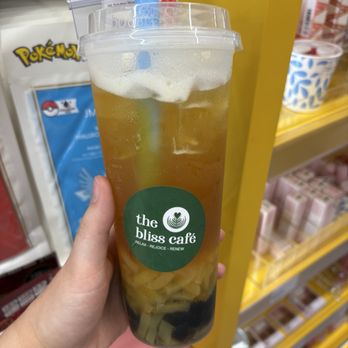 The Bliss Cafe - Passion fruit green tea w/ boba and mango jelly (75% sugar) - Bubble Tea Near Me - Raleigh, North Carolina