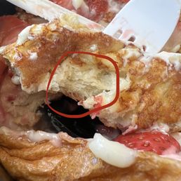 The interior of the French toast, which was dry and did not taste like the custard dip.