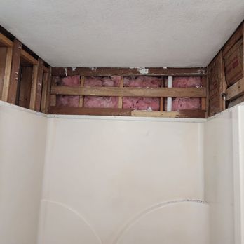The Falls Home Improvement - a bathroom with a hole in the wall - General Contractors Near Me