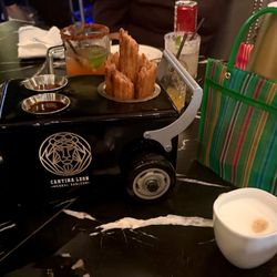 Cinnamon Churros (dulce de leche + chocolate dipping) paired with cappuccino