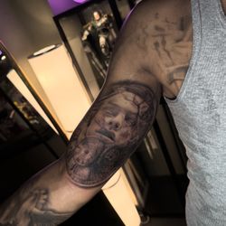 Eliany Ink - Custom face and clock bicep tattoo