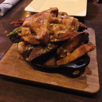 Bosscat Kitchen & Libations - pork belly poutine with andouille sausage gravy and ellsworth creamery cheese curds - New American Near Me - Houston, Texas