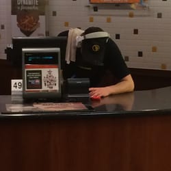 Taco John's - This is how you are greeted at Taco Johns in Sheridan. A kid wearing head phones with a dirty rag on his shoulder.