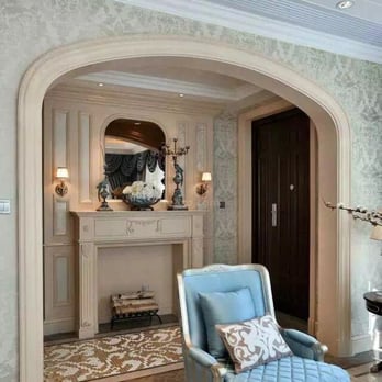 Pines Fountain - a living room with a fireplace and a blue chair - Flooring Near Me - Las Vegas, Nevada Pines Fountain - a living room with a fireplace and a blue chair - Flooring Near Me - Las Vegas, Nevada