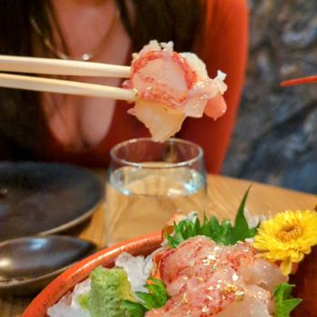 Muni Robata - a bowl of food with chopsticks - Japanese Near Me - Toronto, Ontario Muni Robata - a bowl of food with chopsticks - Japanese Near Me - Toronto, Ontario