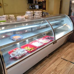 a refrigerated display case in a restaurant a refrigerated display case in a restaurant