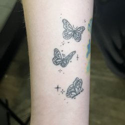 Butterfly filler tattoo