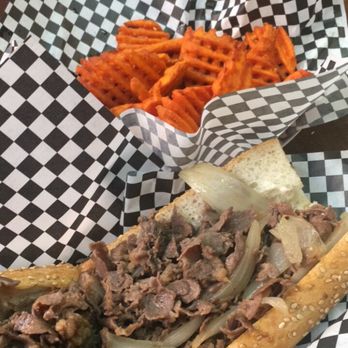 Cleavers - Philly cheesesteak with white cheddar sauce (yea, I know, ur thinking where's the cheese...me too) and sweet potato waffle fries - Cheesesteaks Near Me - Philadelphia, Pennsylvania