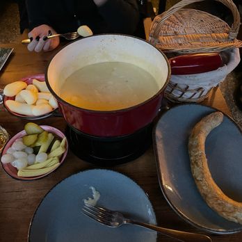Restaurant Silberhorn - Fondu with cheese, and added sausage (for extra cost) - Swiss Food Near Me - Lauterbrunnen, BE Restaurant Silberhorn - Fondu with cheese, and added sausage (for extra cost) - Swiss Food Near Me - Lauterbrunnen, BE