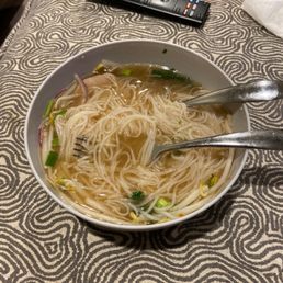 a bowl of soup with noodles a bowl of soup with noodles