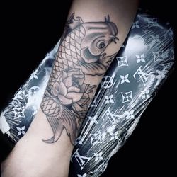 Sacred Art Tattoo and Coffee Bar - Koi done by Jorge