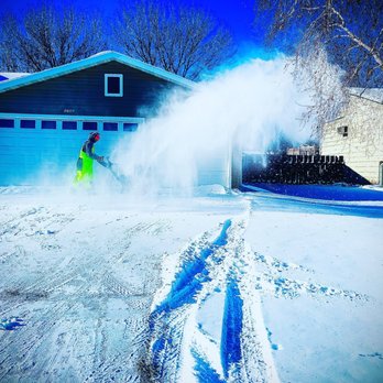 Kiss My Grass - a man using a snow blower - Snow Removal Near Me Kiss My Grass - a man using a snow blower - Snow Removal Near Me