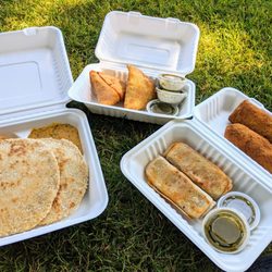 Ambleside Artisan Farmers' Market - Sri Lankan short eats. Left to right: pol roti with pol sambol and lentils,  vegetable samosa, vegetable roti, vegetable rolls.