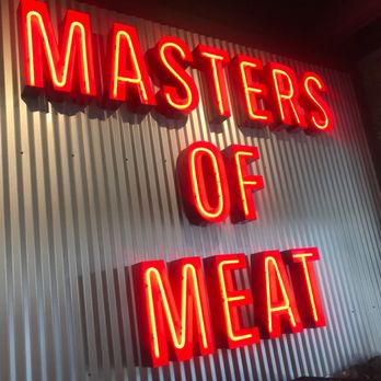 Smokey Bones Avon - a neon sign that says masters of meat - Barbeque Near Me - Avon, Indiana