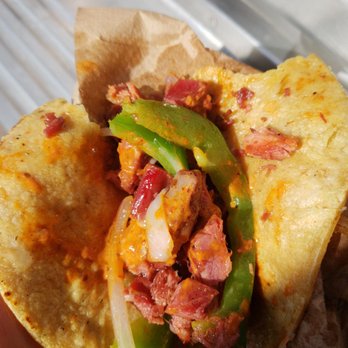 Mariscos German - a hand holding a burrito - Food Trucks Near Me - San Marcos, California Mariscos German - a hand holding a burrito - Food Trucks Near Me - San Marcos, California